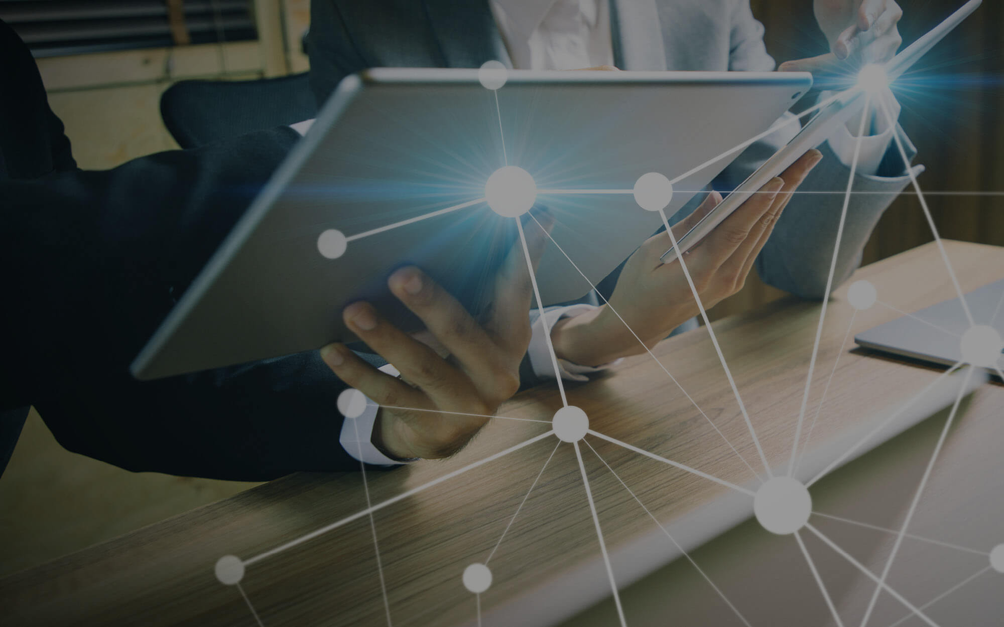 employee holding tablet data overlay