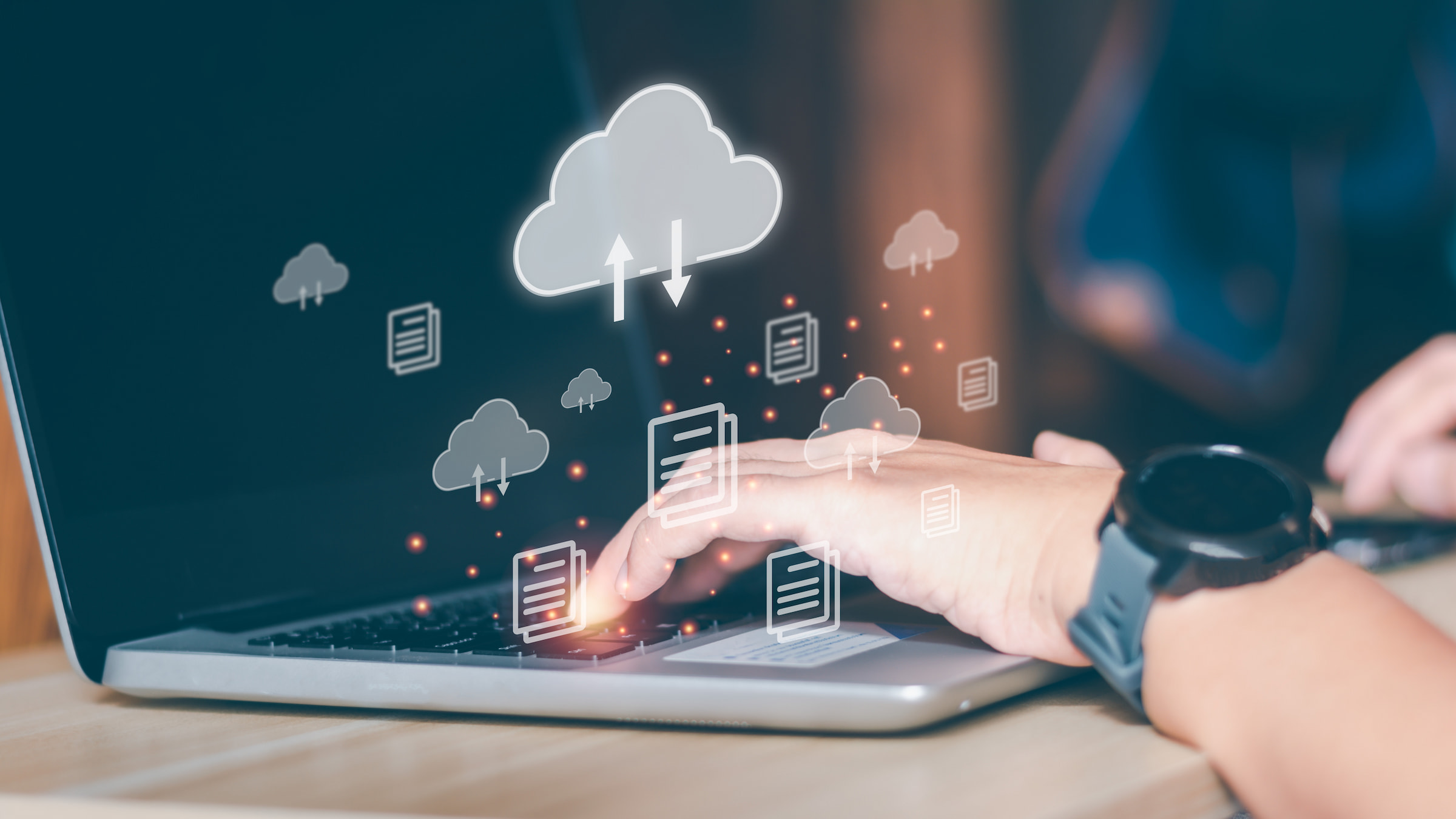 hands using laptop cloud document icons