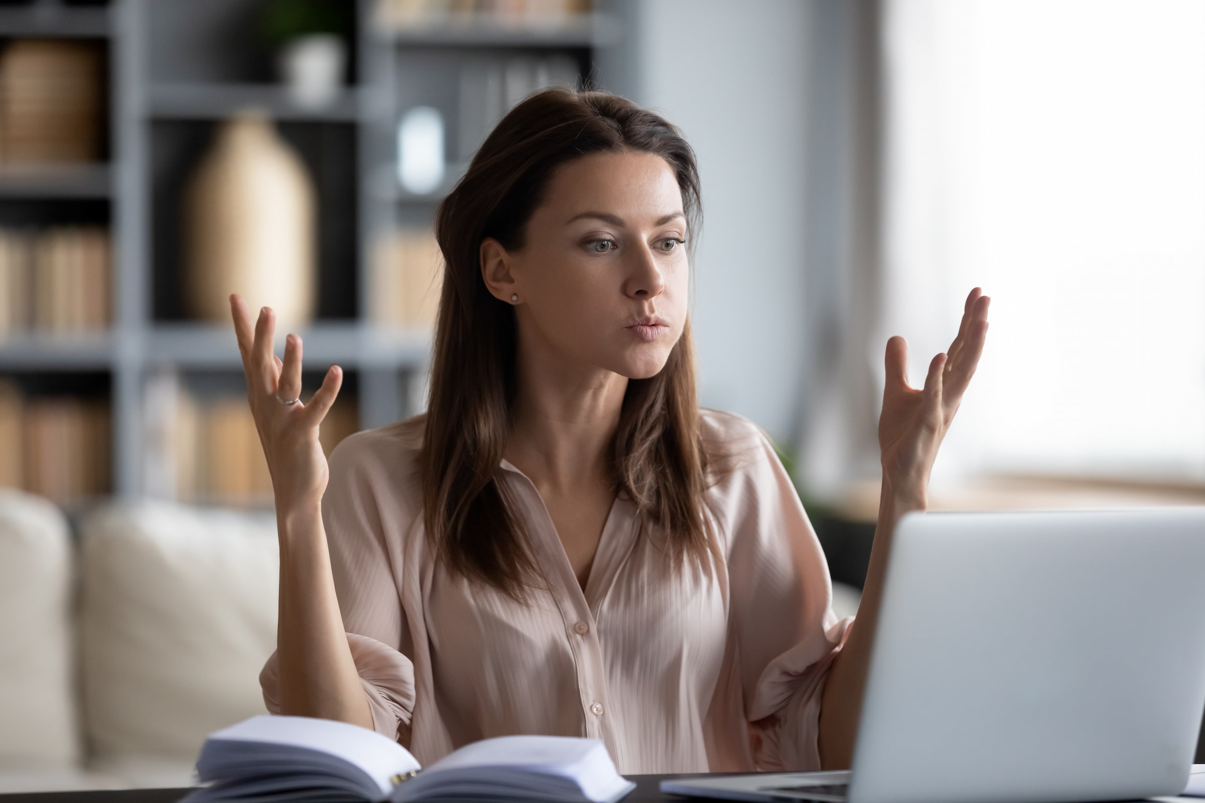 frustrated woman sitting at laptop poor productivity lack reliable tech