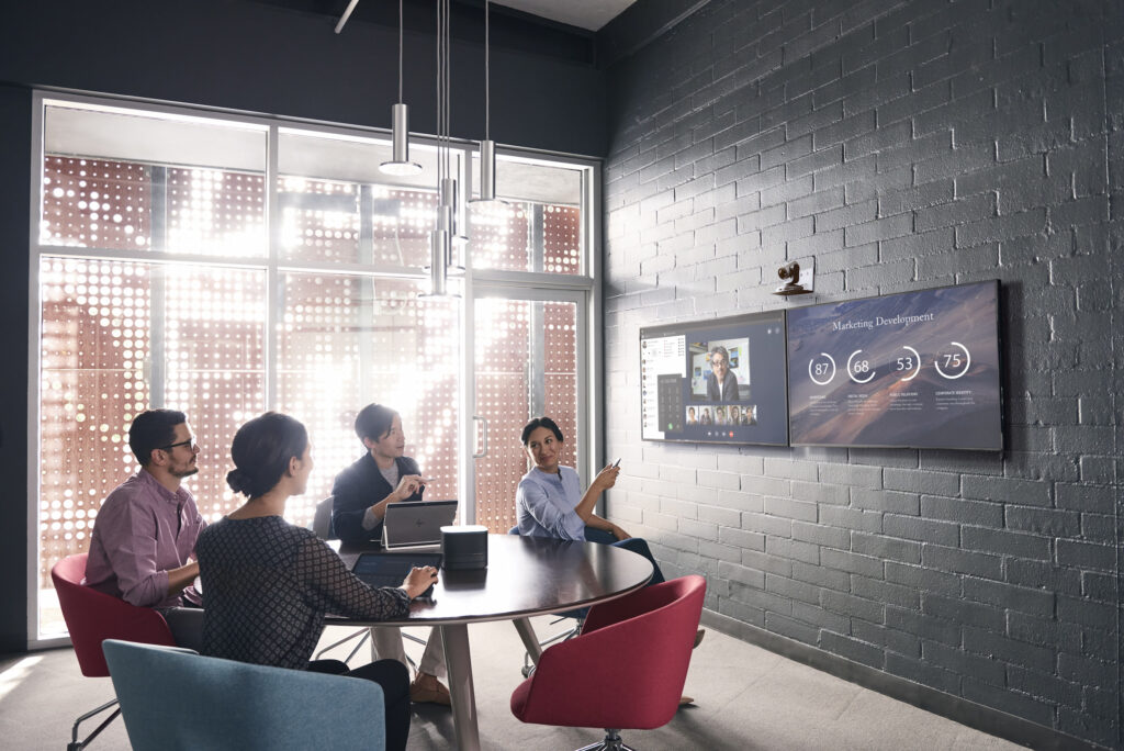 conference-room-stone-wall-video-meeting-round-table