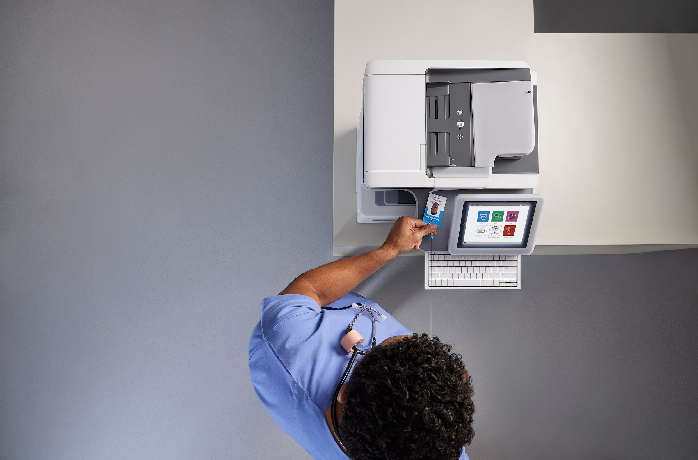 medical professional using printer photocopier grey