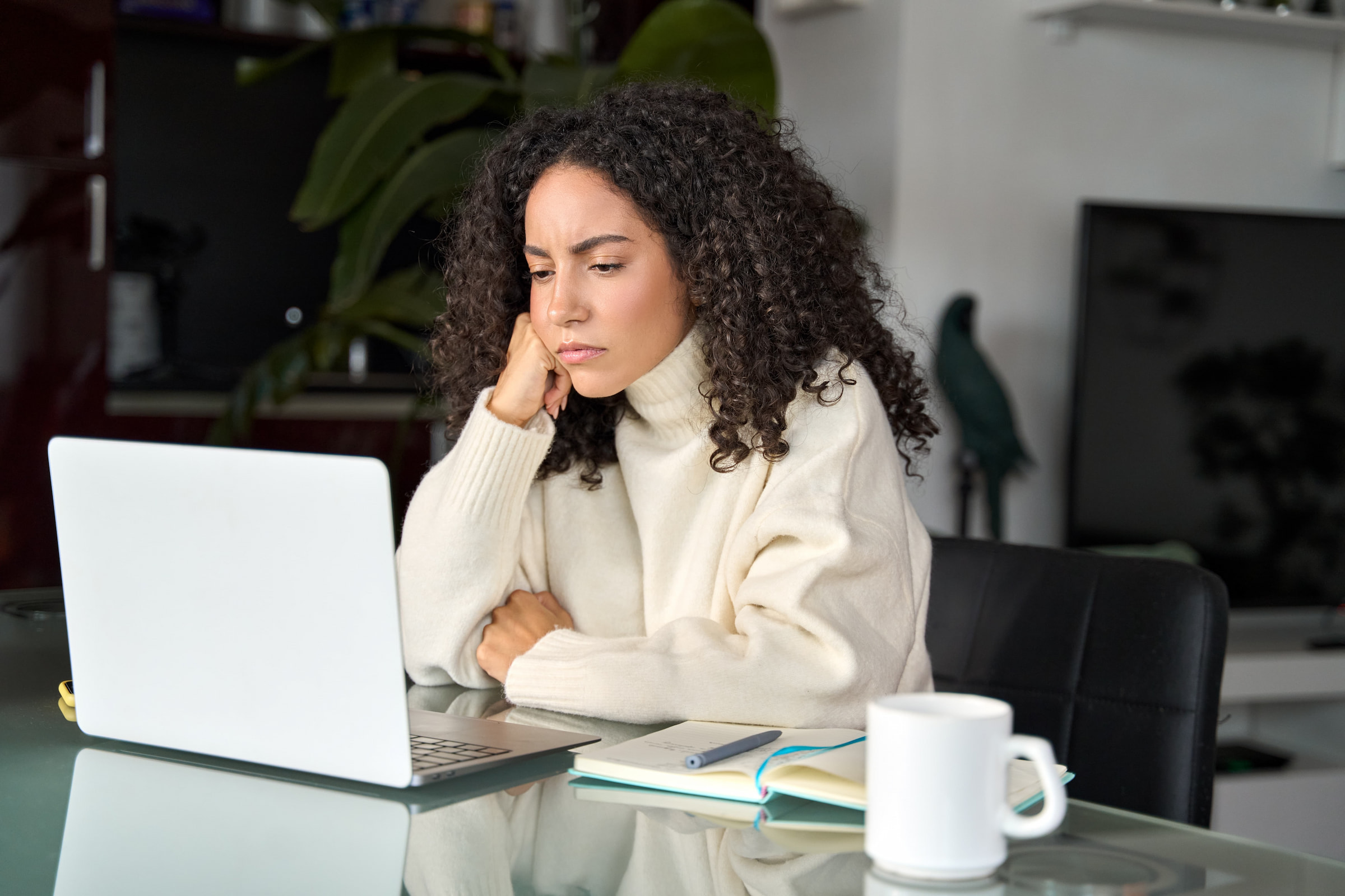hybrid woman looking frustrated in home office