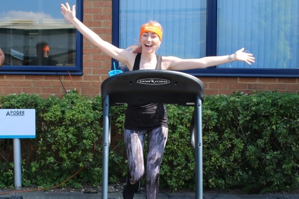 Apogee employee on treadmill for marathon weekend charity challenge