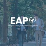Two men walking in a city park with EAP logo