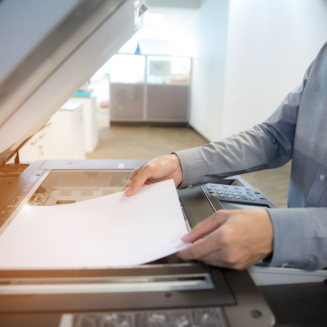 Production Print magnifying glass over photos