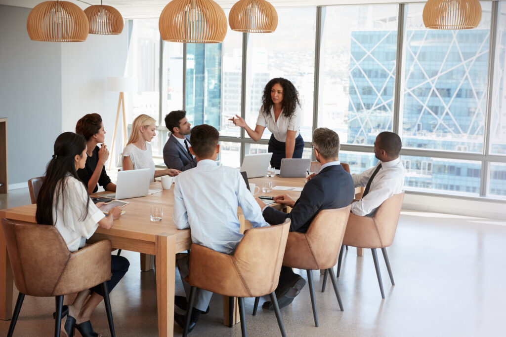 trendy-urban-office-meeting-roundtable-female-speaker