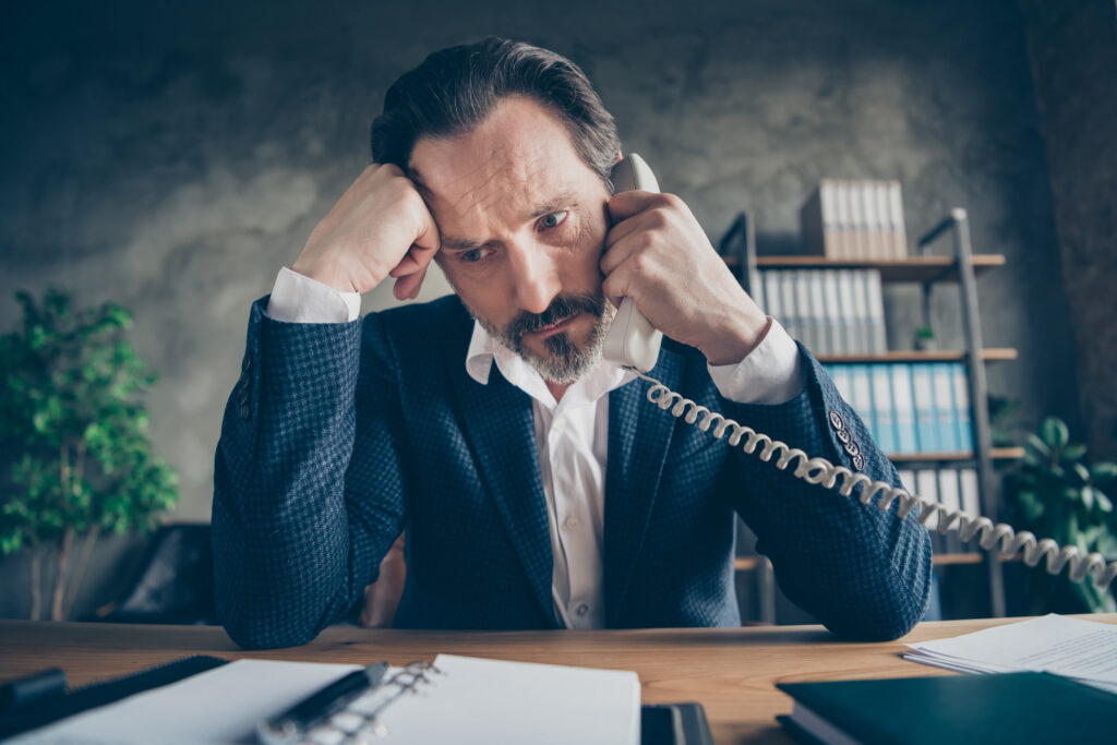 unhappy hr director man on phone in office