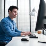 employee works on desktop computer