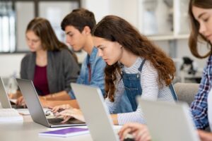 university students using laptops