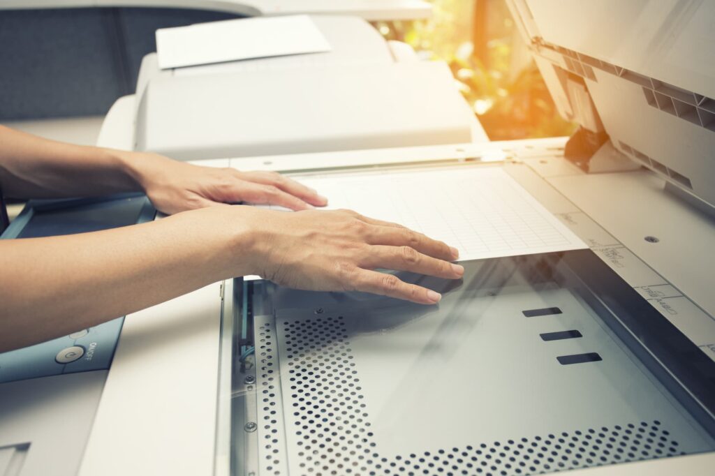 woman scanning a document on an multi-functional device