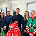 apogee employees giving presents to maidstone tunbridge wells hospital childrens ward