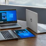 hp laptops on wood office table imaging services