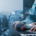 typing on a keyboard with security network graphic overlay