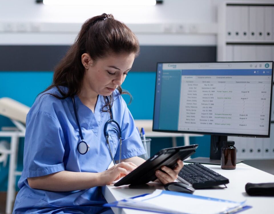 nurse on tablet at computerdesk square