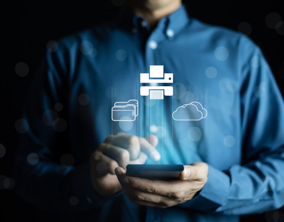 man in blue buttoned shirt using smartphone to manage cloud and printer