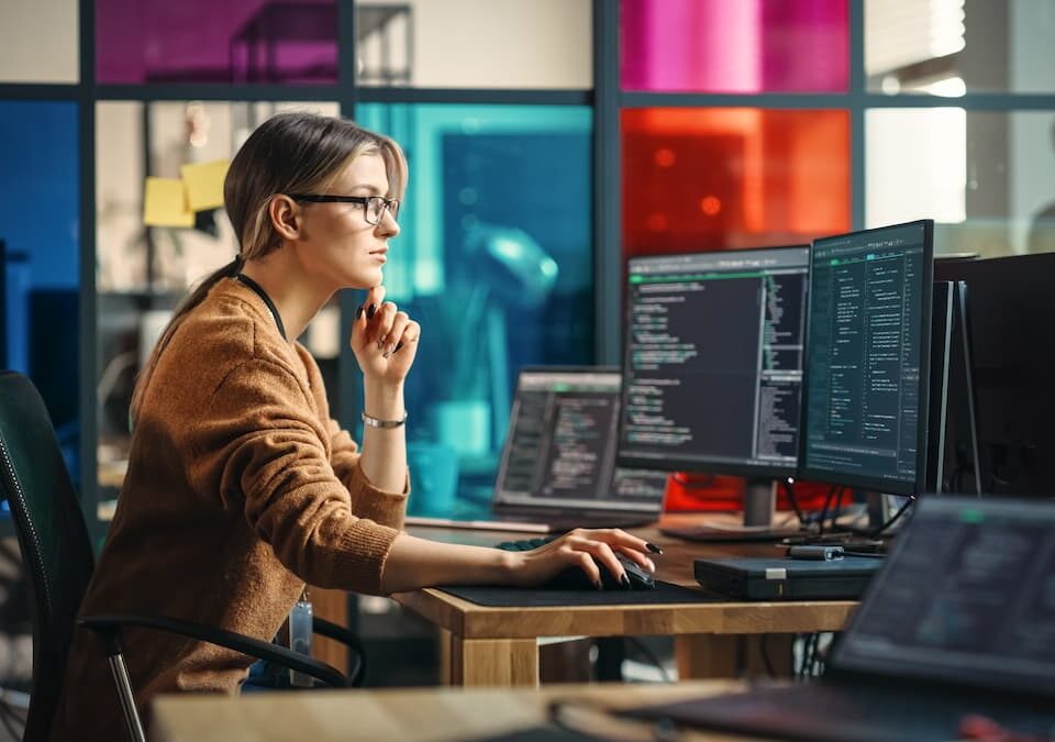 woman using computers in data centre managed it services