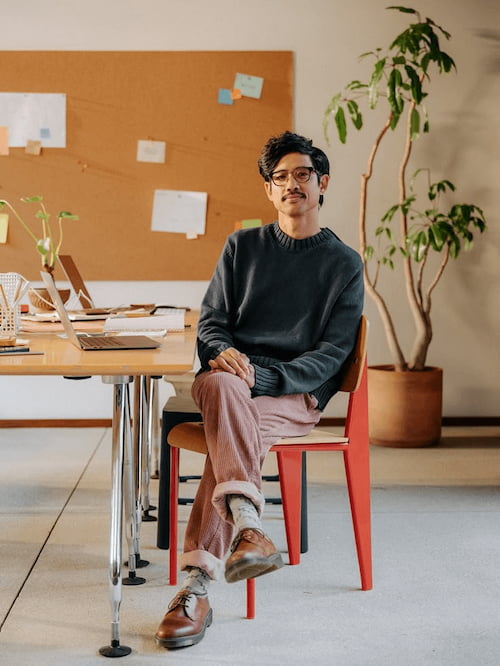 man sitting on chair in office