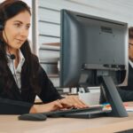 business woman with headset remote it support laptop